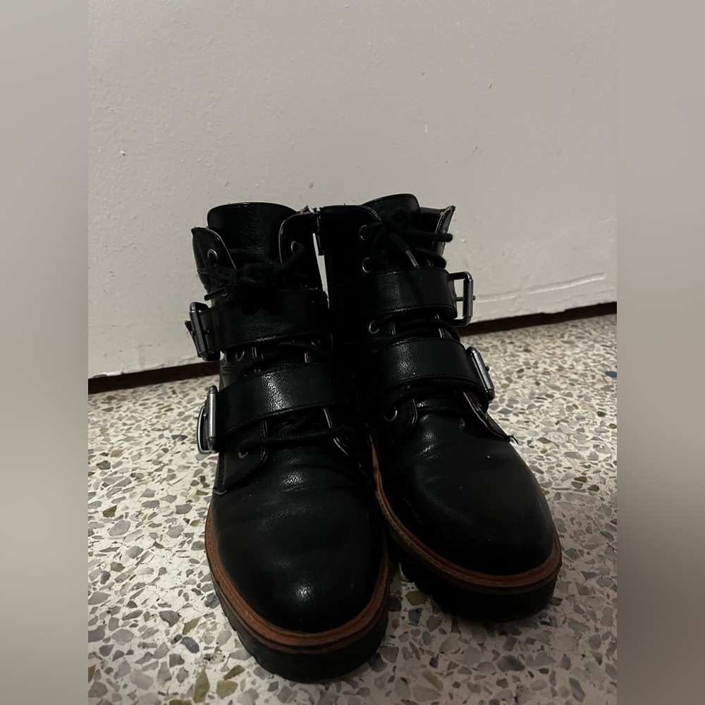 Black leather boots with laces.